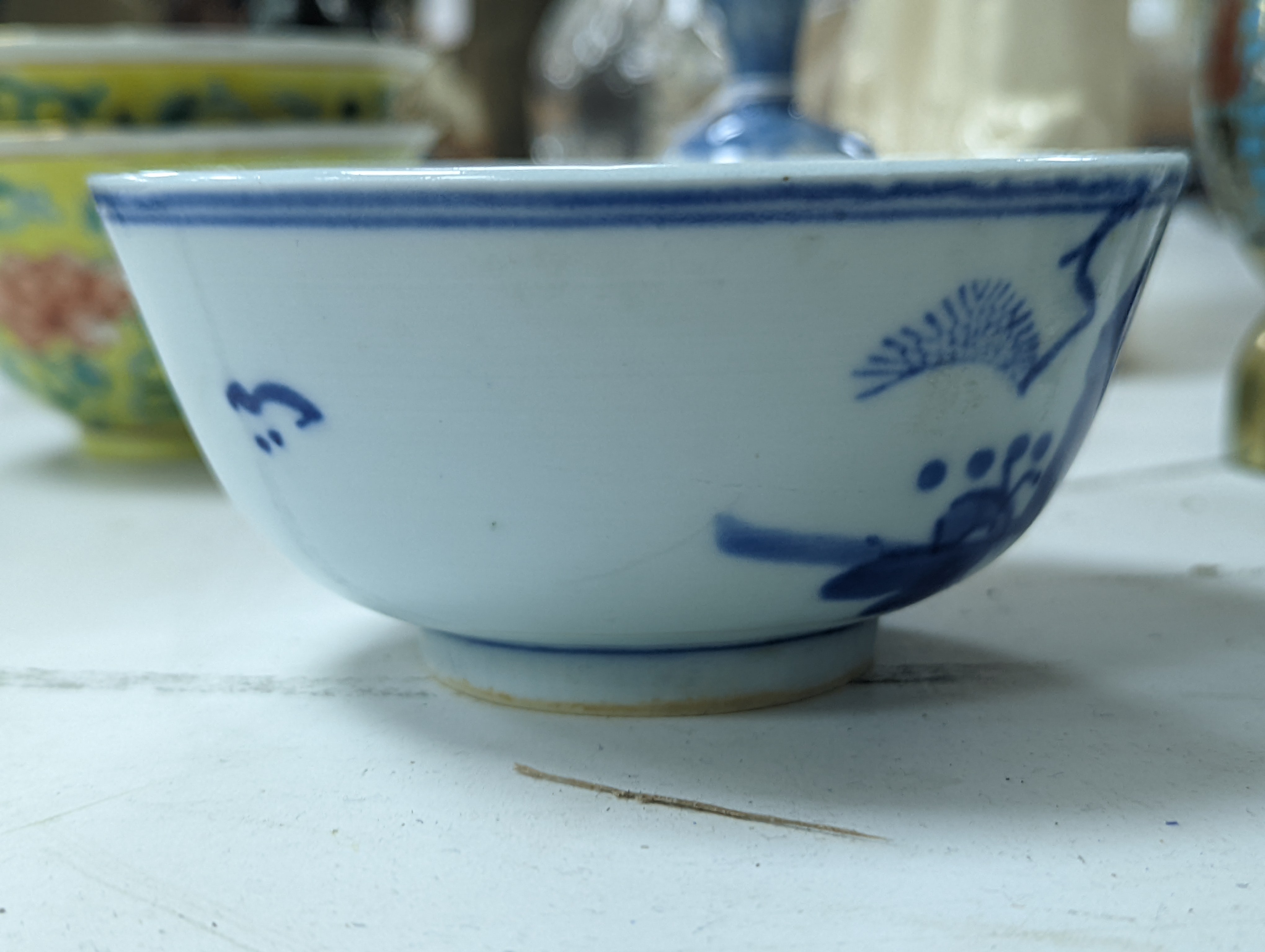 A group of Chinese porcelain, 19th /20th century, to include a pair of yellow ground bowls, 10.8 cm diameter, a blue and white vase, Xuande mark, a similar bowl and vase, and a champleve enamel bronze koro and cover